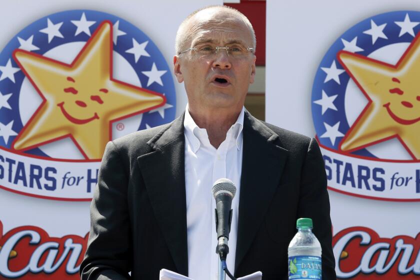 Andy Puzder, chief executive of CKE Restaurants Inc., speaks at a news conference in Austin, Texas, in 2014.