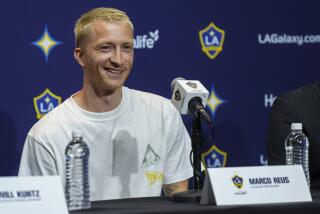 German free-agent midfielder Marco Reus smiles as he is introduced as the new Los Angeles Galaxy soccer player during a news conference at Dignity Health Sports Park in Carson, Calif., Friday, Aug. 16, 2024. (AP Photo/Damian Dovarganes)