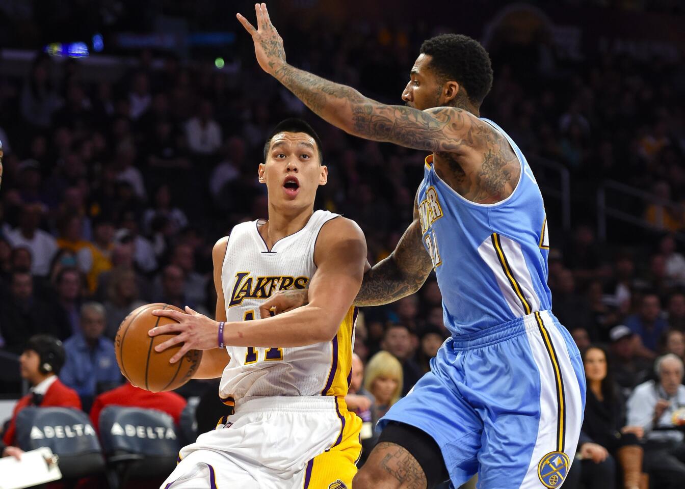 Nuggets forward Wilson Chandler tries to cut off a drive by Lakers point guard Jeremy Lin in the first half.