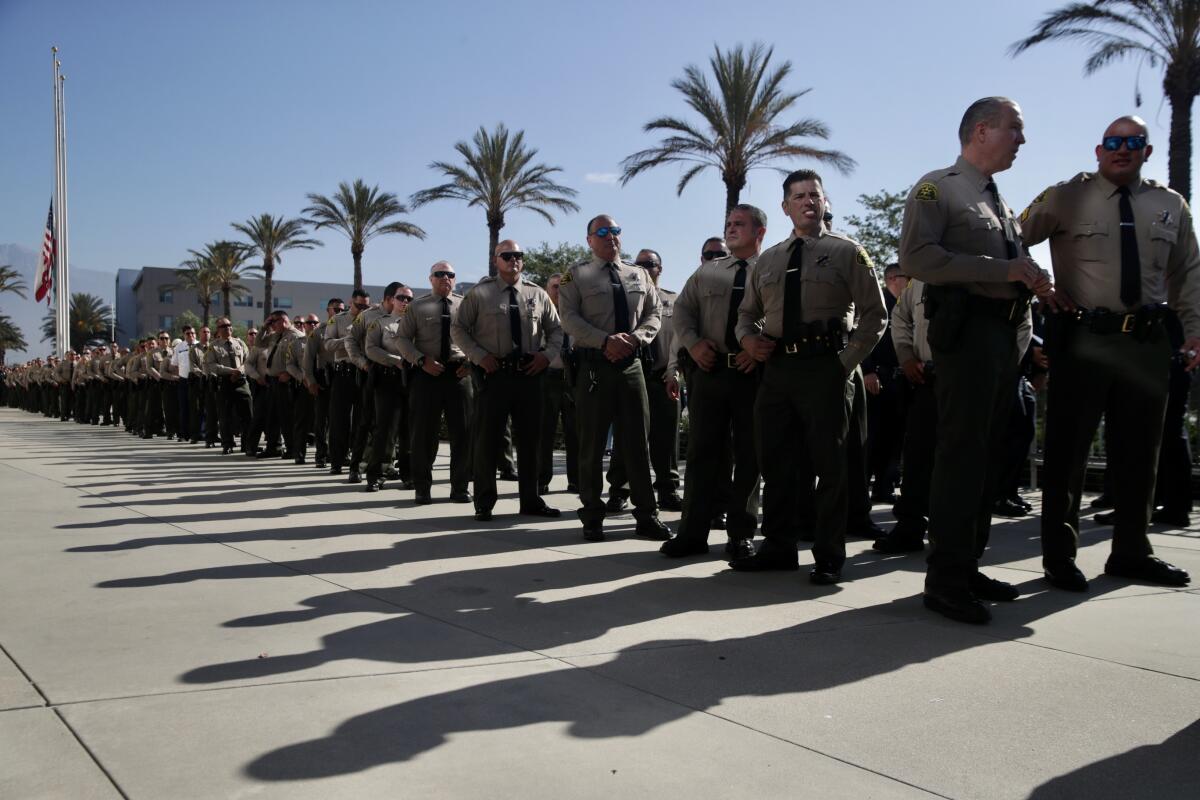 Los Angeles County sheriff's deputies line up for a memorial