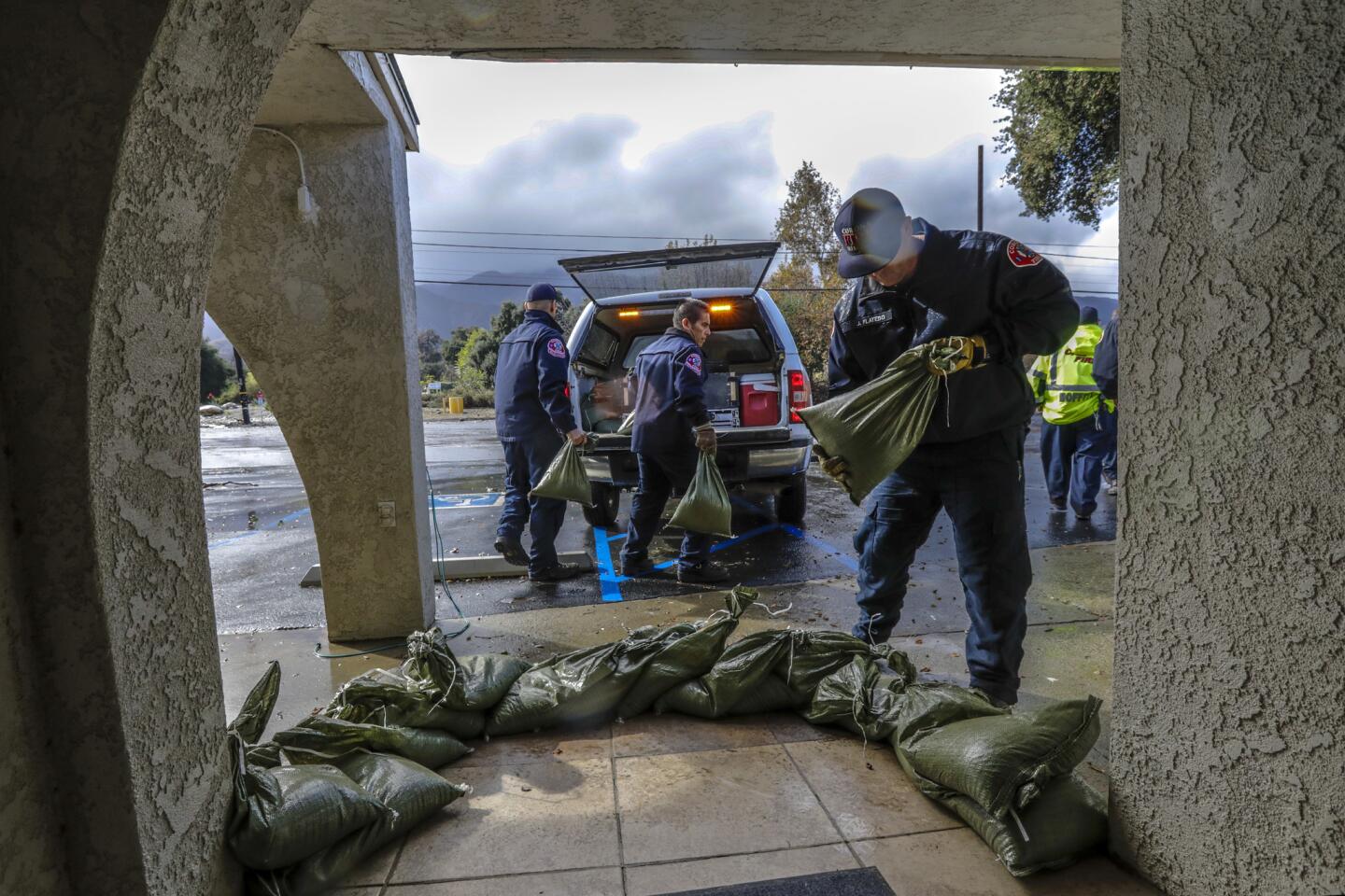 Storm rolls across fire-scarred regions of California