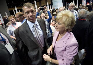 Vince McMahon and his wife, Linda McMahon, amid a crowd of people