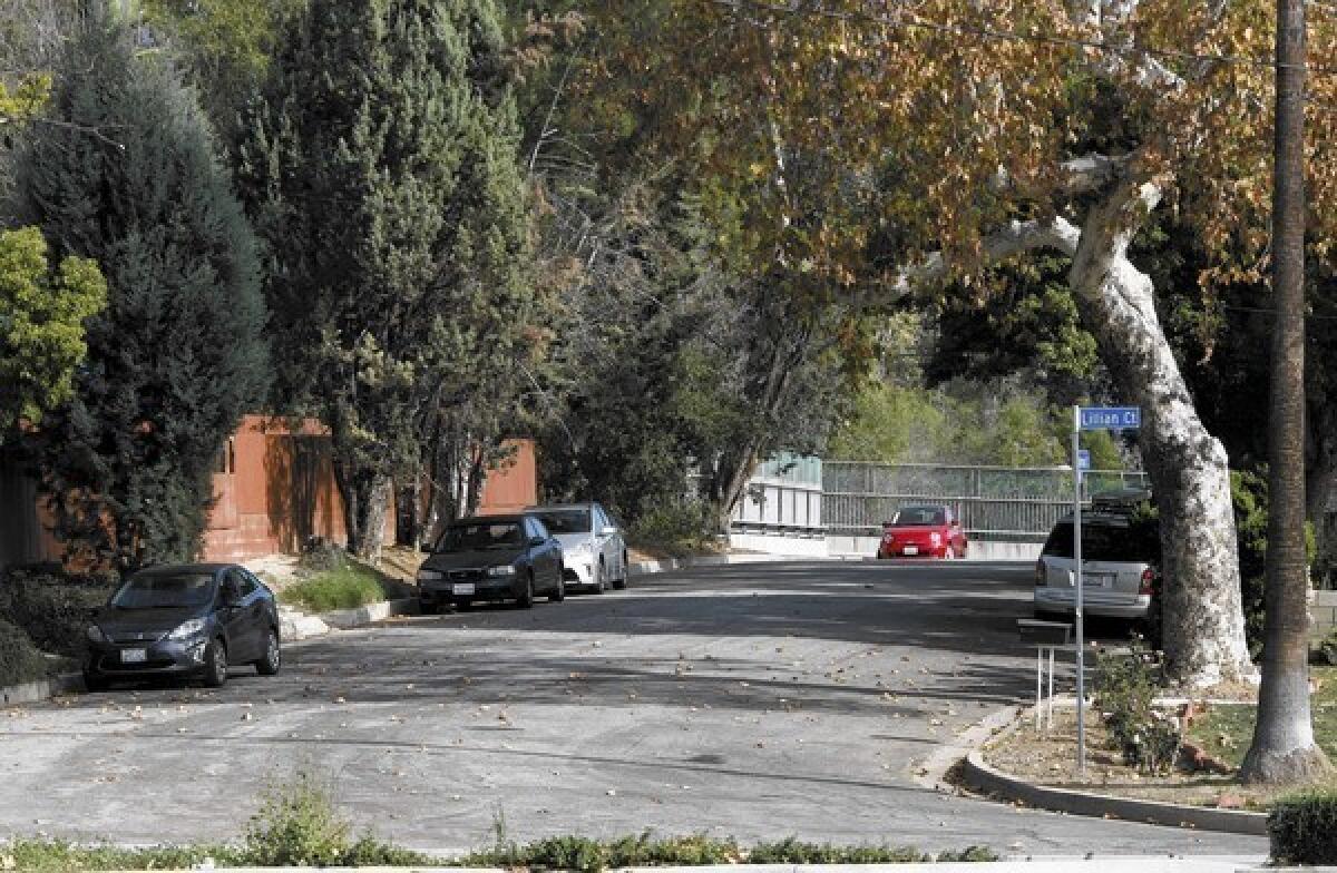 A few cars park on Houseman at Lilllian Court near the La Cañada Flintridge Towne Center on Saturday, Jan. 25, 2014. Restricted parking signs will be placed in this area.