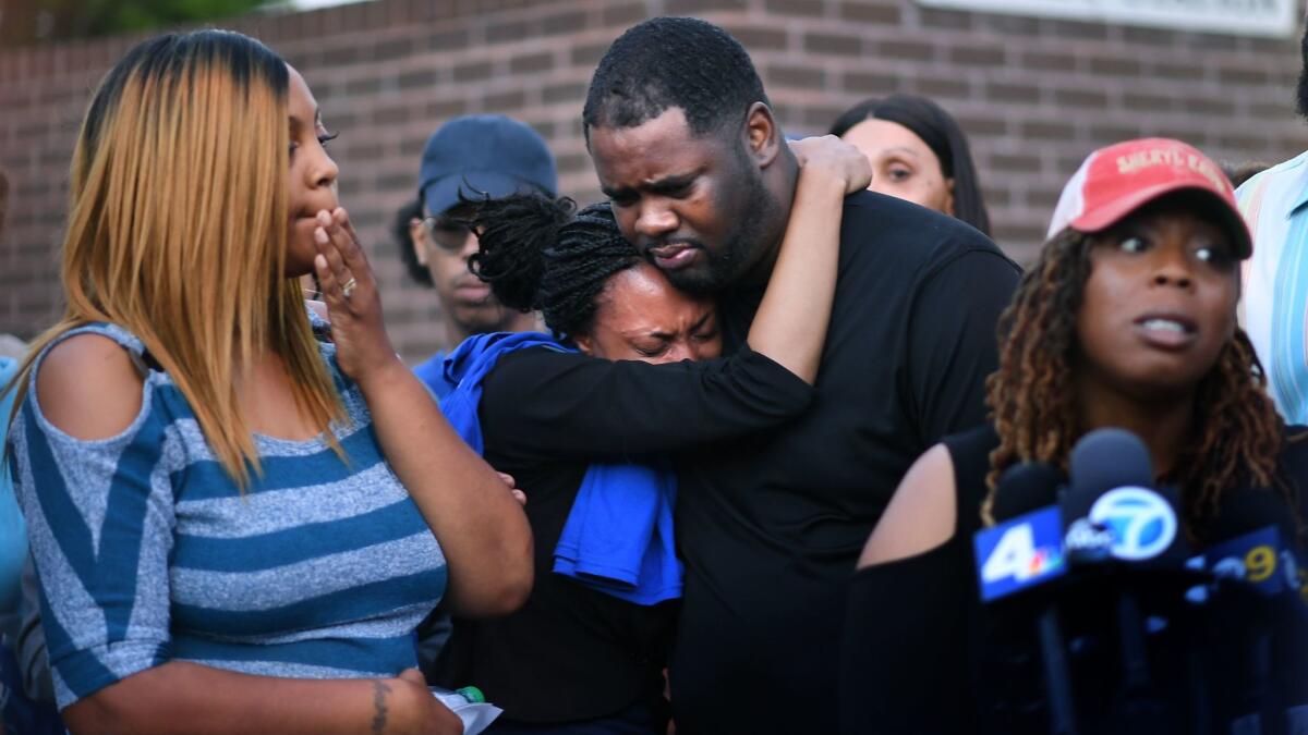 LaTisha Nixon, left, the mother of Gemmel Moore, attends a news conference outside the West Hollywood sheriff's station. Moore was found dead of a drug overdose in the home of prominent Democratic donor Ed Buck, and his family wants an investigation.