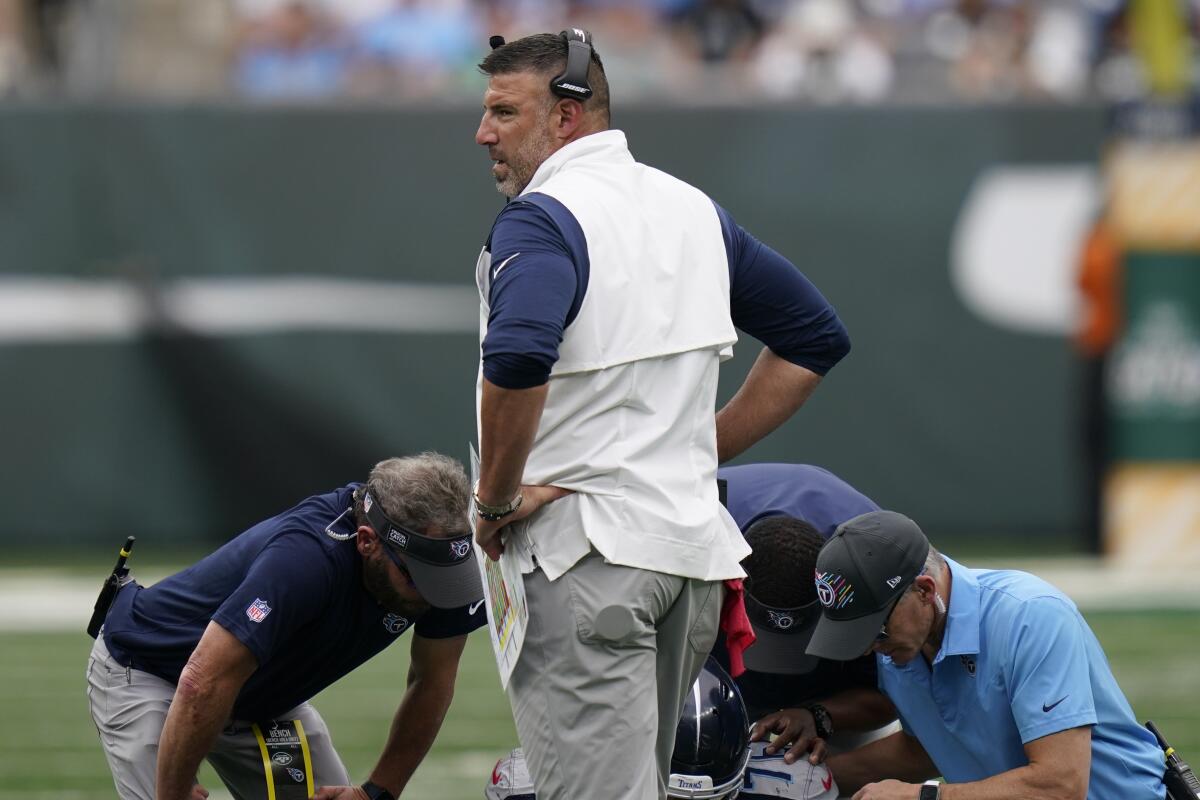 Tennessee Titans head coach Mike Vrabel stands on the field during a medical break during the second half of an NFL football game against the New York Jets, Sunday, Oct. 3, 2021, in East Rutherford, N.J. (AP Photo/Seth Wenig)