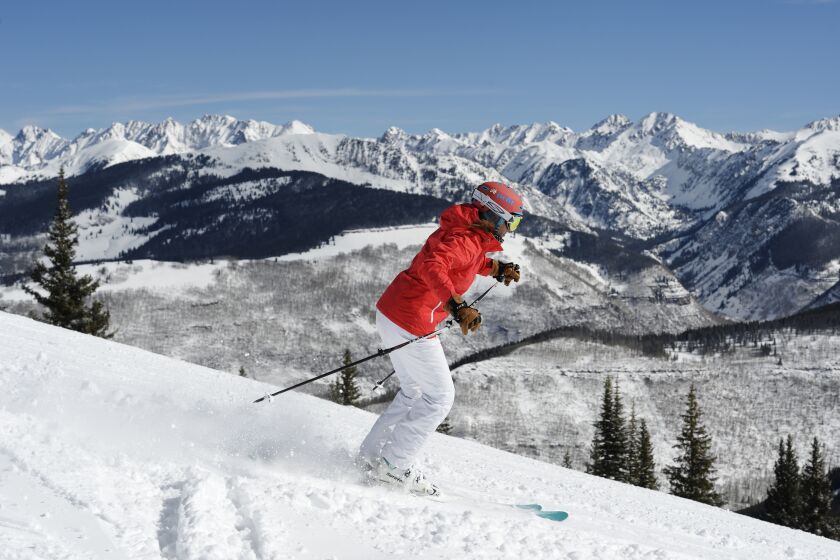A skier makes tracks down a run near the Blue Sky Basin Overlook at the Vail Resort.