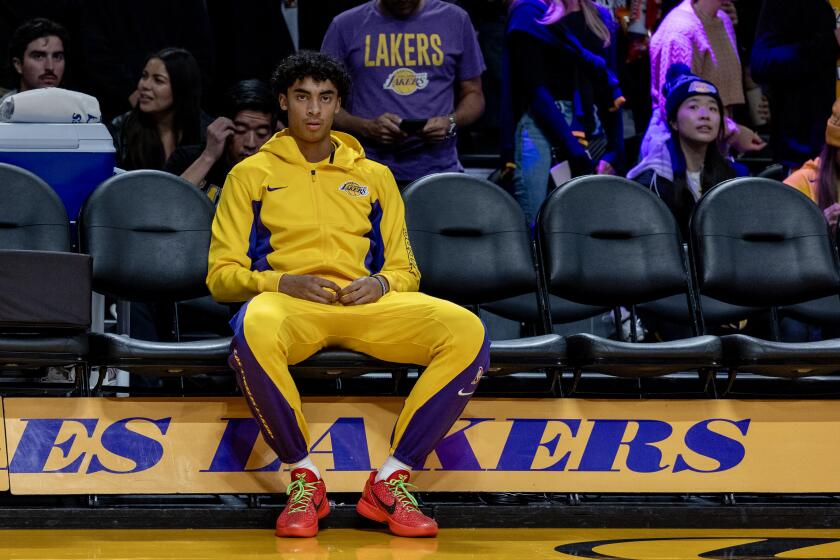 LOS ANGELES, CA - DECEMBER 2, 2023: Los Angeles Lakers guard Max Christie (10) sits on the bench before the game against the Houston Rockets at Crypton.com Arena on December 2, 2023 in Los Angeles, California.(Gina Ferazzi / Los Angeles Times)