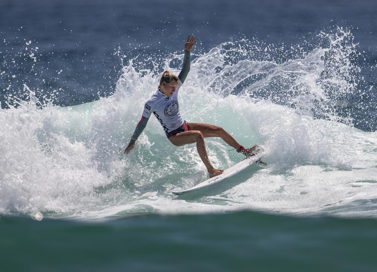 Sanoa Dempfle-Olin does a slashing turn while competing in the women's Junior Tour at the U.S. Open of Surfing.