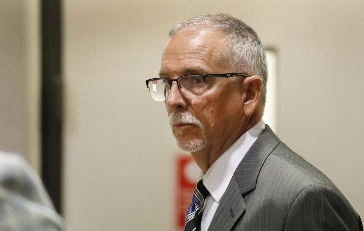 Dr. James Heaps, in suit and tie, appears at a June 26, 2019, court hearing.