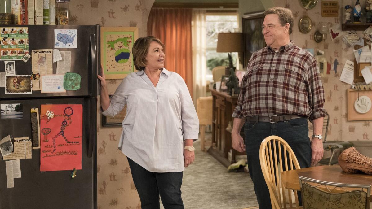 Roseanne Barr, left, and John Goodman appear in a scene from the comedy series "Roseanne." The series, which returns for the second season of its revival next year, has been a hit for ABC.
