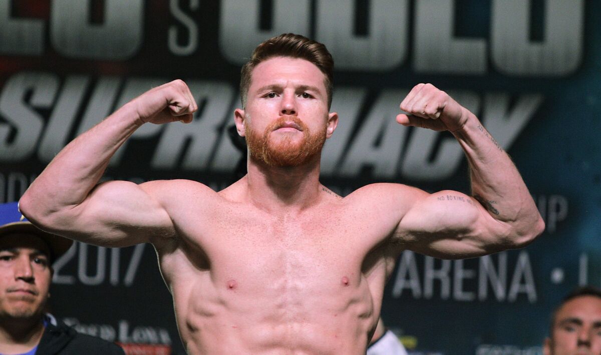 In this file photo taken on September 15, 2017 boxer Canelo Alvarez poses on the scales during a weigh-in with Gennady Golovkin at the MGM Grand Hotel & Casino in Las Vegas, Nevada. Mexican middleweight Saul "Canelo" Alvarez was handed a six-month ban by the Nevada State Athletic Commission on April 18, 2018 over the failed drug test which forced his rematch with Gennady Golovkin to be cancelled. At a hearing in Las Vegas, the commission unanimously approved a deal that will see Alvarez suspended for six months from the date of his failed test on February 17.