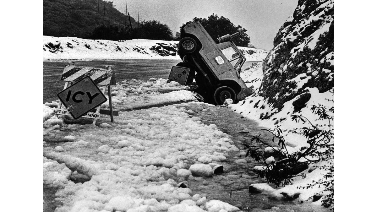 Dec. 18, 1978: A Caltrans vehicle ended up on its nose after skidding on snow-covered Angeles Crest Highway near Mt. Wilson.