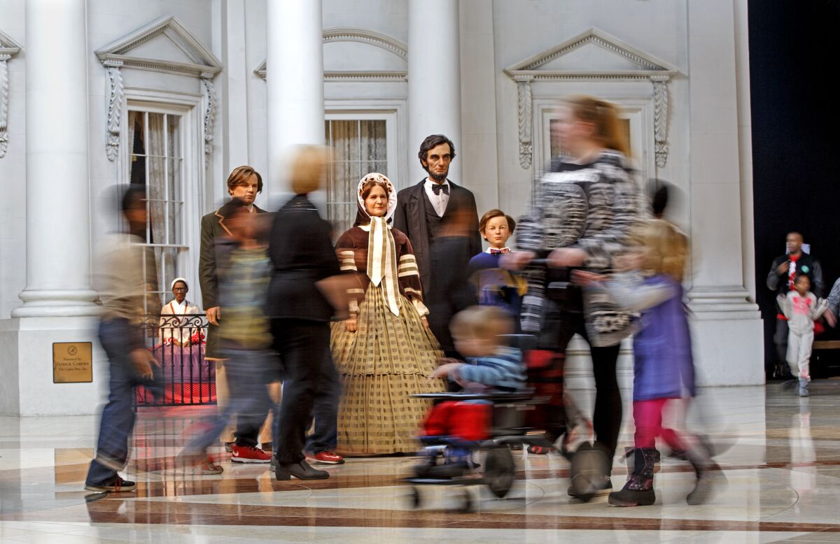 Figures of the Lincoln family greet visitors as they stream by the "White House South Portico" exhibit at the Abraham Lincoln Presidential Museum in Springfield, Ill., on Feb. 10, 2015.