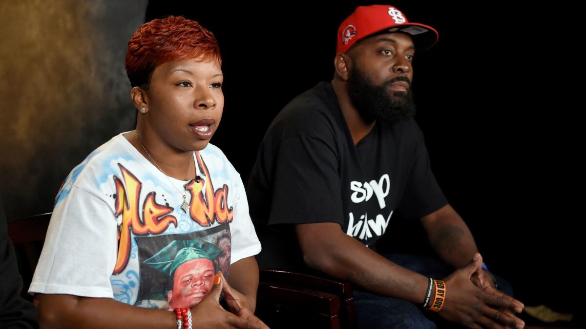 The parents of Michael Brown, Lezley McSpadden, left, and Michael Brown Sr., received a $1.5 million settlement in a wrongful-death lawsuit.