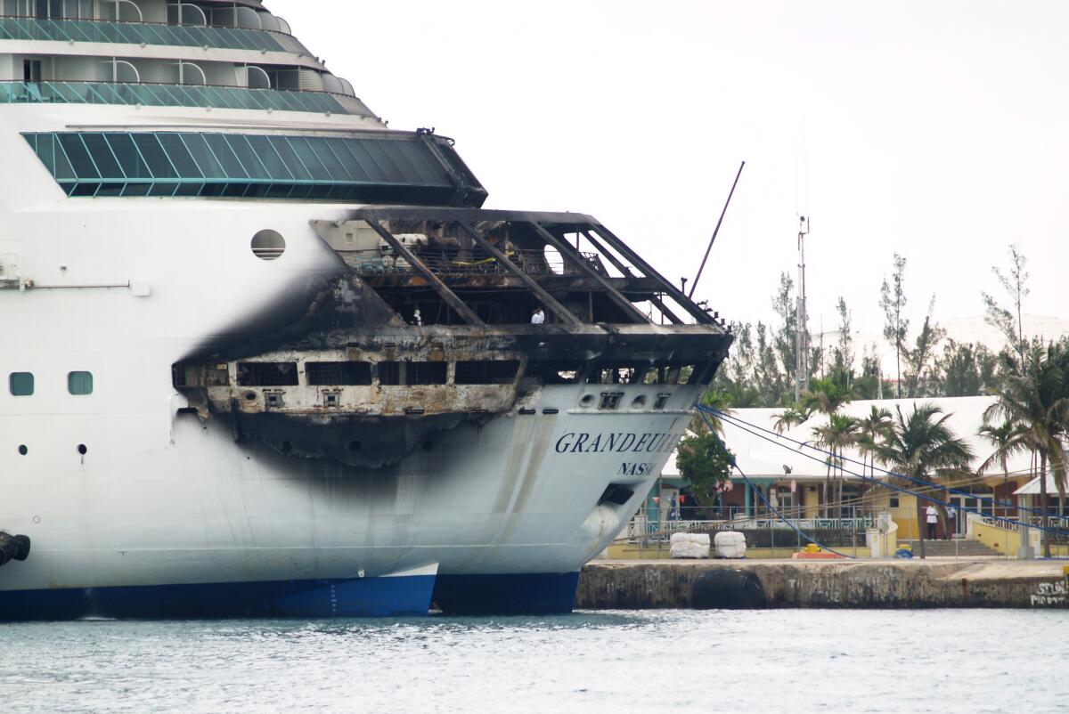 The fire-damaged Grandeur of the Seas cruise ship is docked in Freeport in the Bahamas. Royal Caribbean said the fire occurred early Monday while en route from Baltimore to the Bahamas.