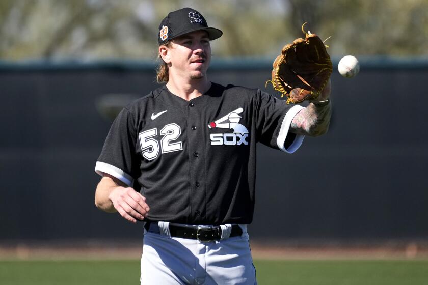 Chicago White Sox starting pitcher Mike Clevinger (52) works out during a spring training baseball.