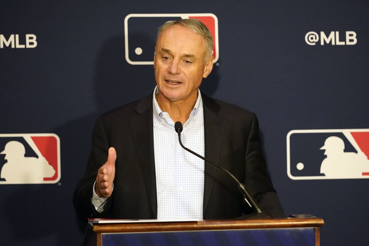 MLB commissioner Rob Manfred makes comments during a news conference.