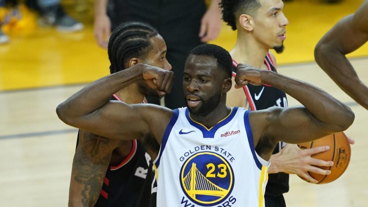 Warriors forward Draymond Green reacts after scoring against the Raptors in Game 3 on Wednesday.