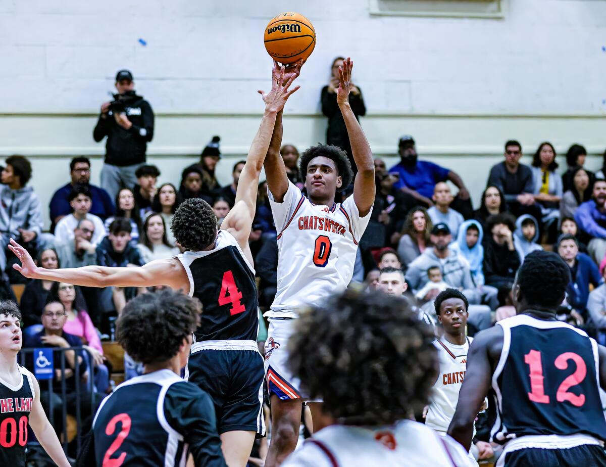 Alijah Arenas of Chatsworth High attempts a jump shot over a defender.