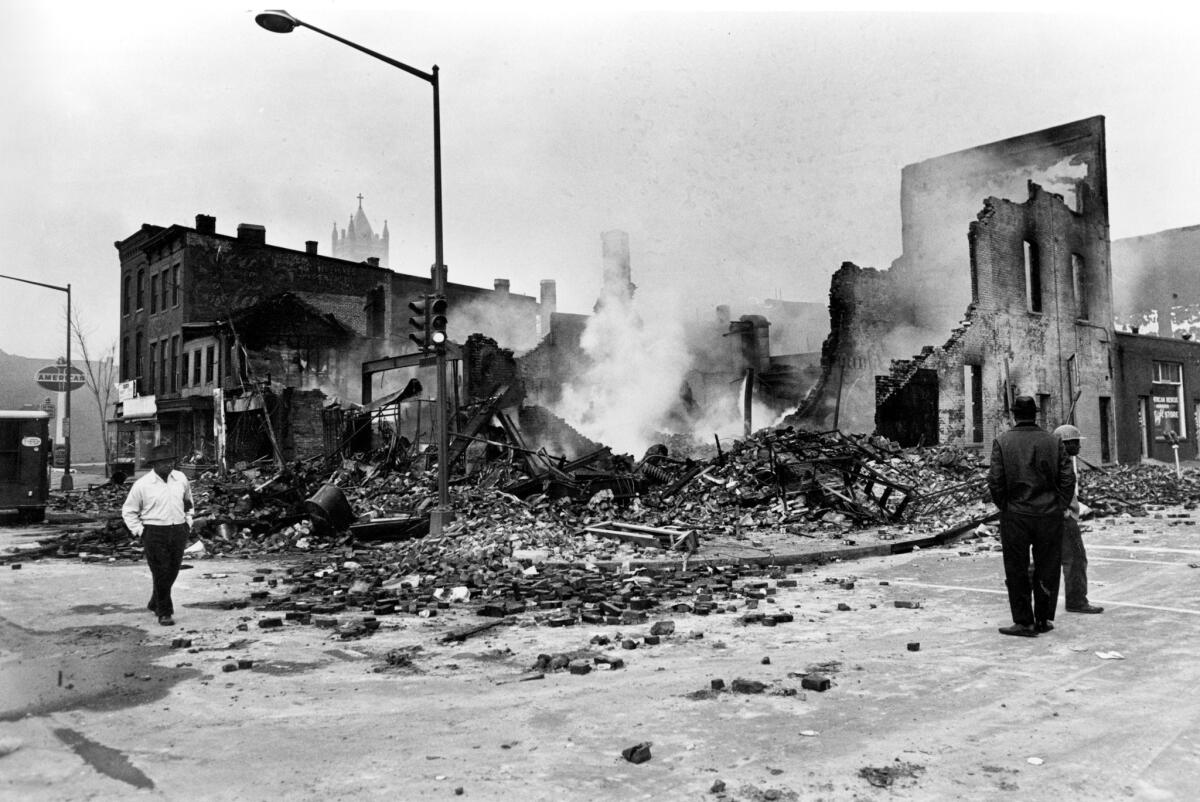 Smoldering ruins remain where a building stood in northwest Washington. Numerous fires accompanied turmoil in the nation's capital following King's assassination.