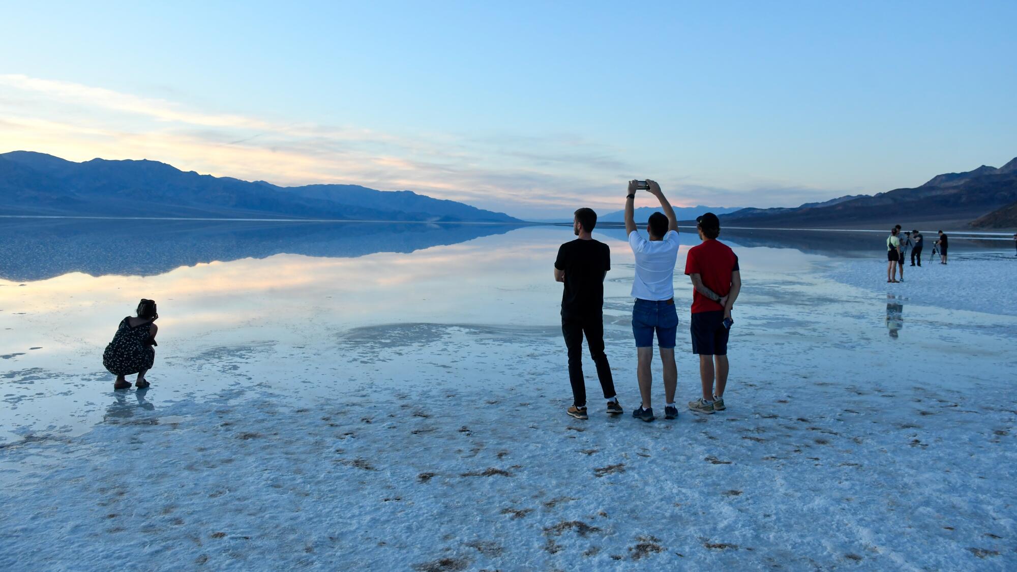 Visitors take in Badwater Basin in Death Valley National Park.