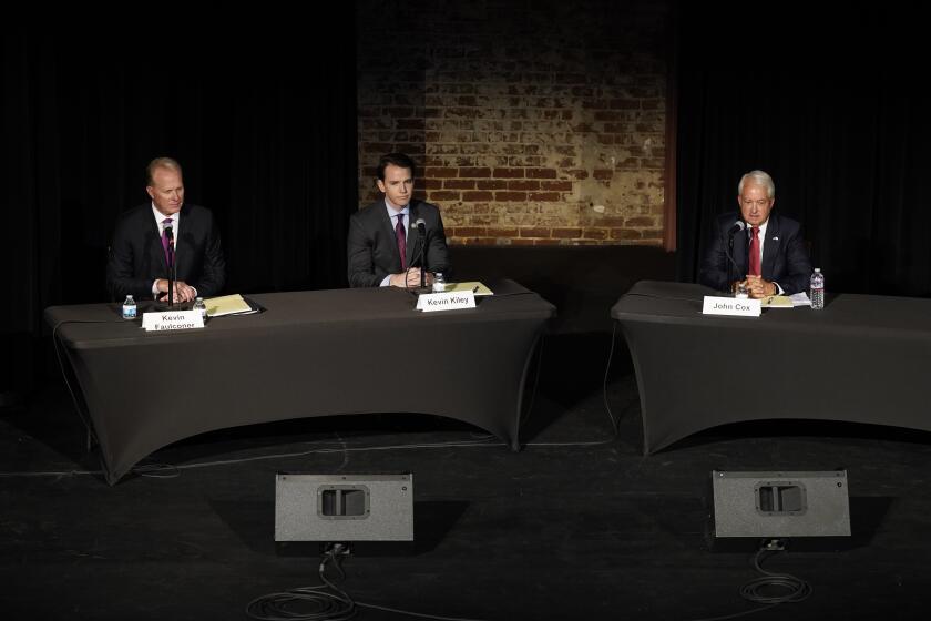 Republican gubernatorial recall candidates, former San Diego Mayor Kevin Faulconer, left, Assemblyman Kevin Kiley, center, and businessman John Cox, right, participate in a debate held by the Sacramento Press Club in Sacramento, Calif., Tuesday, Aug. 17, 2021. California voters have until Sept. 14 to cast their ballots to either retain Democratic Gov. Gavin Newsom or to recall him and select one of the more than 40 choices on the ballot. (AP Photo/Rich Pedroncelli)