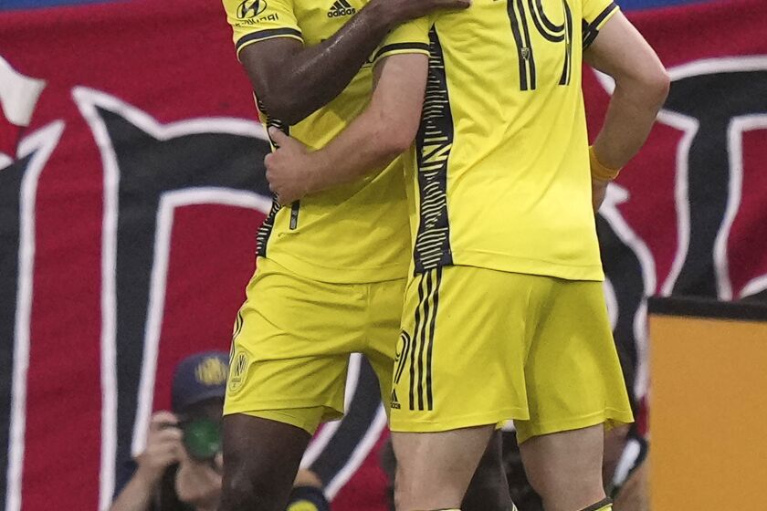 Nashville SC's Shaq Moore, left, celebrates his goal against FC Dallas with Alex Muyl (19) during the first half of an MLS soccer match Saturday, June 3, 2023, in Frisco, Texas. (AP Photo/LM Otero)