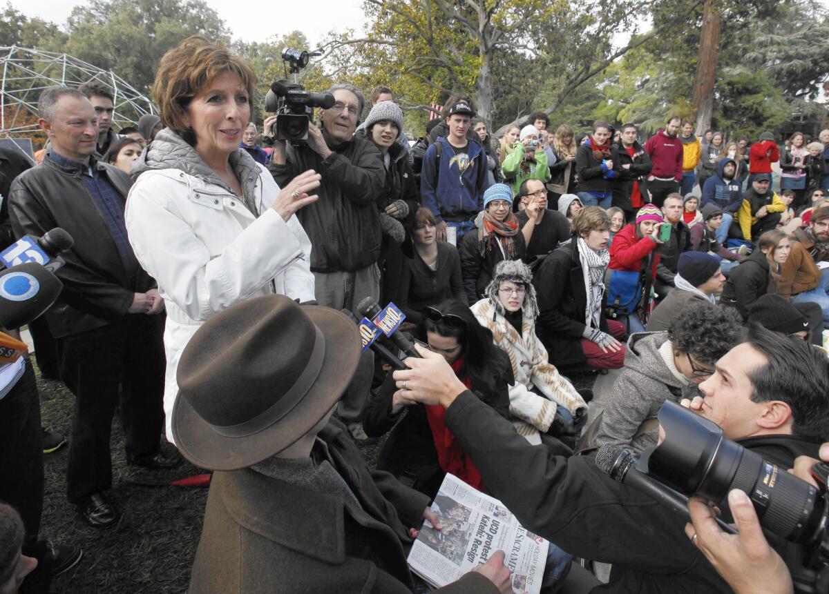 Chancellor Linda Katehi, left, at an Occupy UC Davis encampment on the campus in 2011, days after a controversial pepper-spraying incident by campus police.