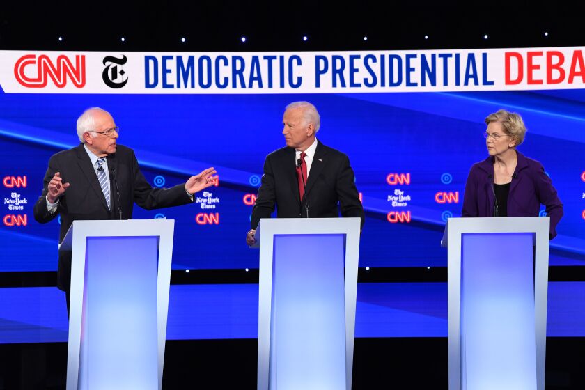 Democratic presidential hopefuls Vermont Senator Bernie Sanders (L), Former Vice President Joe Biden (C), and Massachusetts Senator Elizabeth Warren participate during the fourth Democratic primary debate of the 2020 presidential campaign season co-hosted by The New York Times and CNN at Otterbein University in Westerville, Ohio on October 15, 2019. (Photo by SAUL LOEB / AFP) (Photo by SAUL LOEB/AFP via Getty Images)