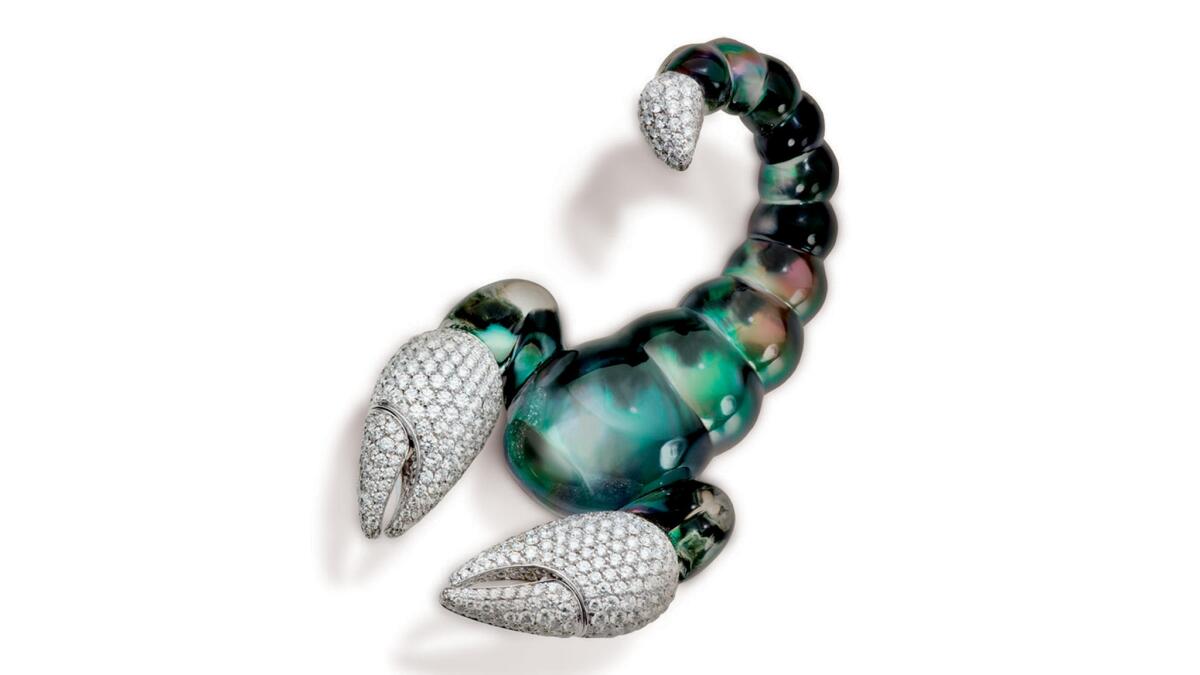 Vhernier 18-karat white gold Scorpione brooch with green mother of pearl, diamonds and rock crystal, $63,700 at Vhernier in Beverly Hills, (310) 273-2444.