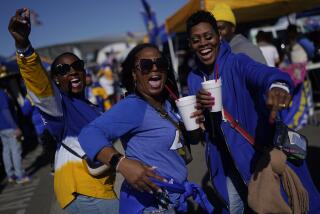 Fans tailgate before an NFL football game between the Los Angeles Rams and the Arizona Cardinals 