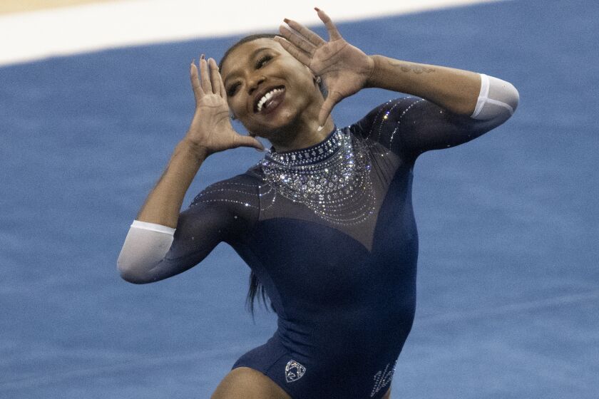 UCLA's Nia Dennis competes on the floor during an NCAA gymnastics meet against Arizona State on Saturday, Jan. 23, 2021, in Los Angeles. (AP Photo/Kyusung Gong)