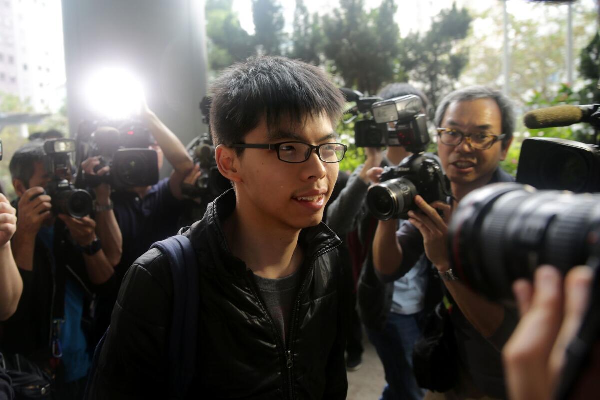 Joshua Wong arrives in court Thursday in Hong Kong to support the Mong Kok protesters charged with rioting.