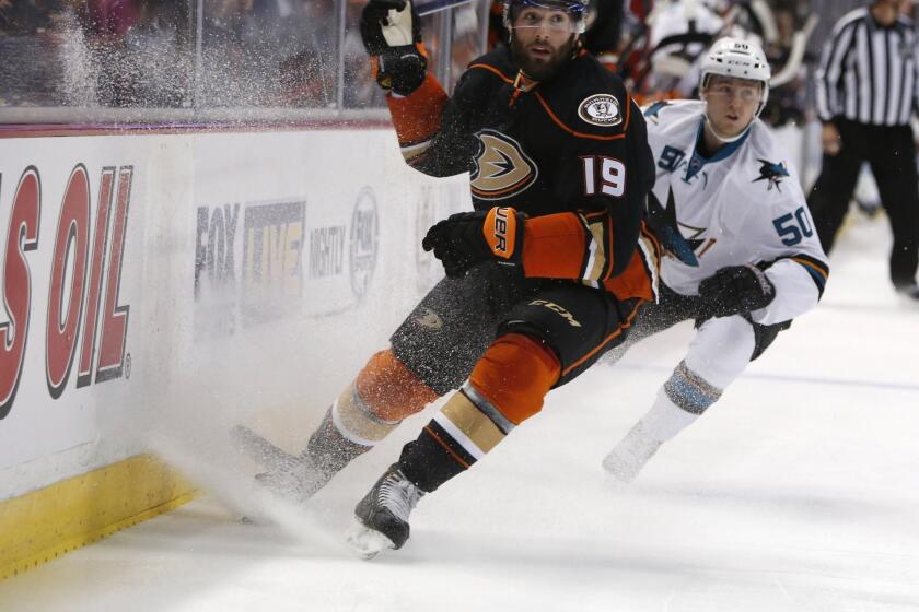 The Ducks' Patrick Maroon and San Jose's Chris Tierney compete during a preseason game in Anaheim on Oct. 4.