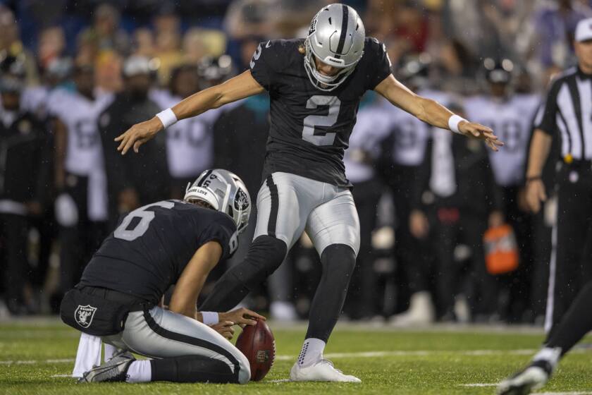 Daniel Carlson kicks a field goal for the Las Vegas Raiders in the Hall of Fame Game.