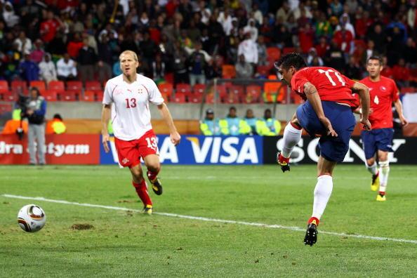 Mark Gonzalez of Chile scores the first goal during the 2010 FIFA World Cup South Africa Group H match between Chile and Switzerland at Nelson Mandela Bay Stadium on June 21, 2010 in Port Elizabeth, South Africa.