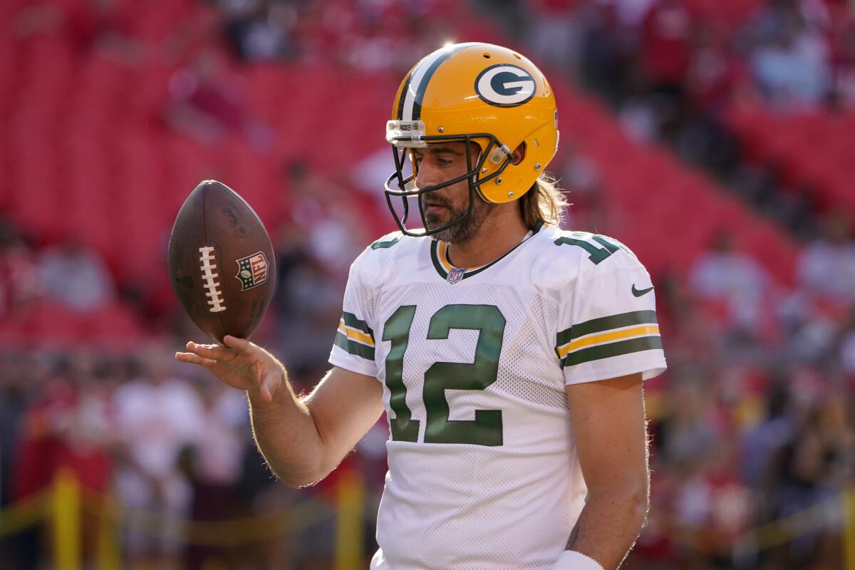 Green Bay Packers quarterback Aaron Rodgers warms up before the start of a preseason game.