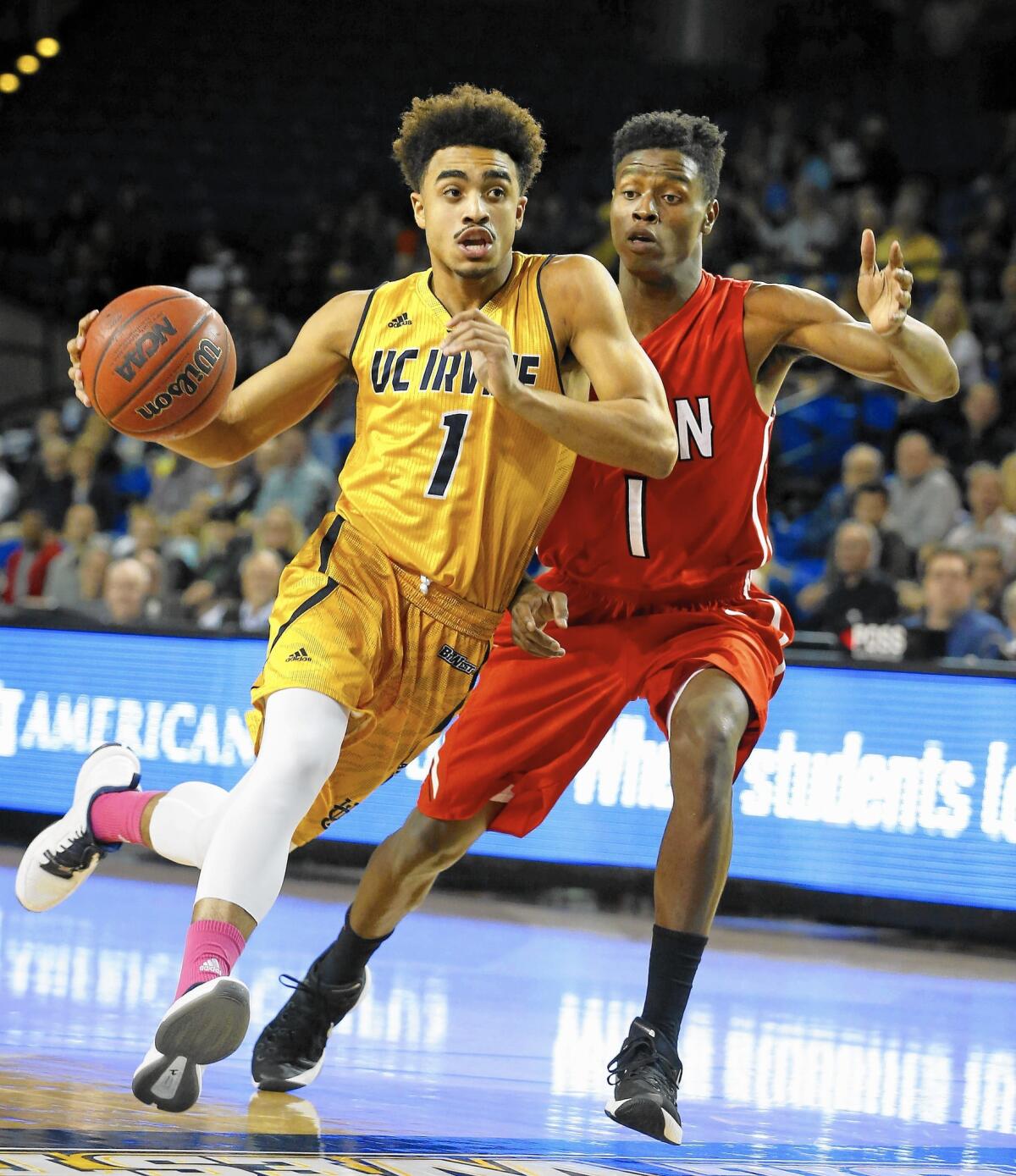 UC Irvine's Alex Young (1), who scored a career-high 36 points, gets a step on Cal State Northridge guard Micheal Warren in a Big West Conference game on Saturday.
