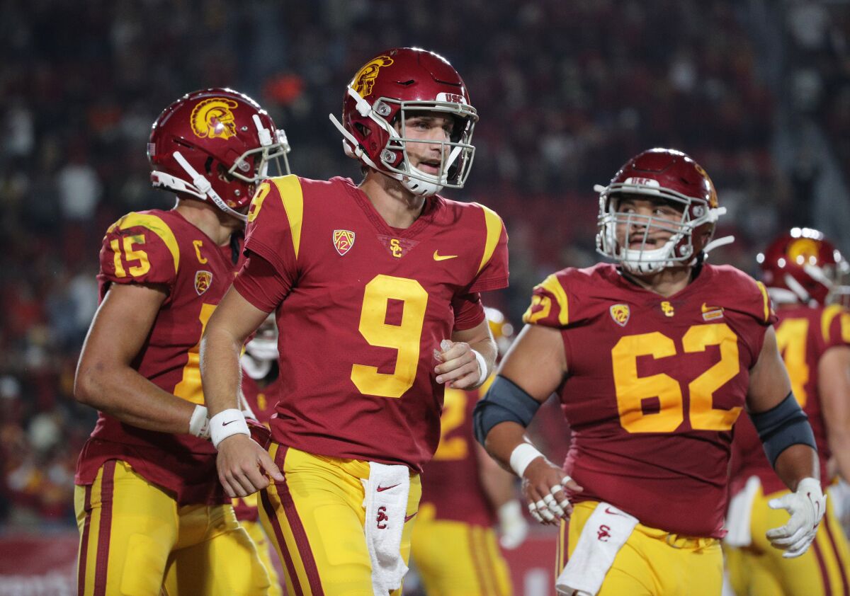USC quarterback Kedon Slovis (9) runs off the field after the Trojans scored a touchdown