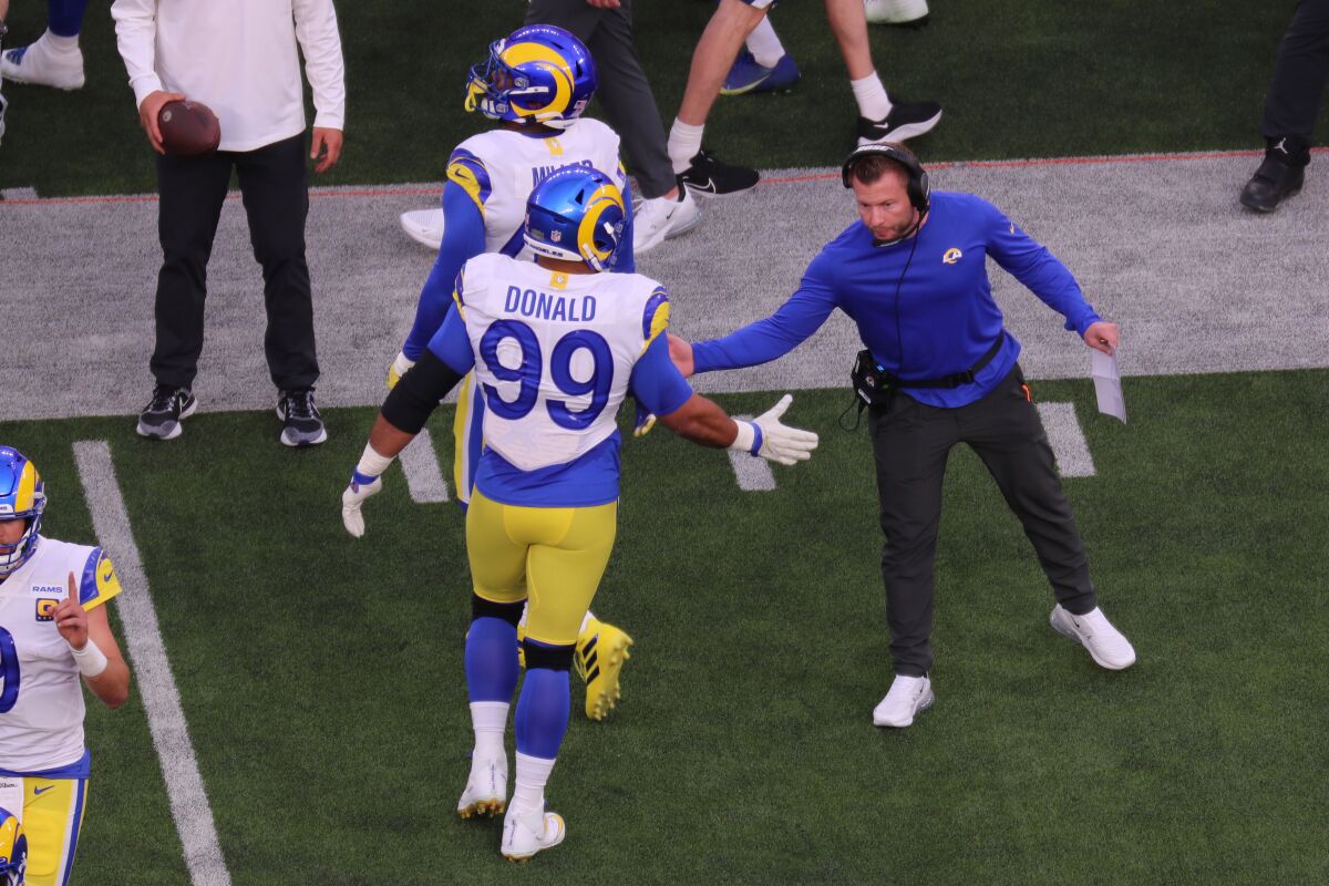 Rams head coach Sean McVay congratulates Aaron Donald (99) during Super Bowl LVI.