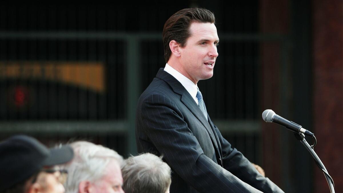 Then-Mayor Gavin Newsom speaks in San Francisco in 2005, when he was in the middle of a statewide debate over pit bulls.