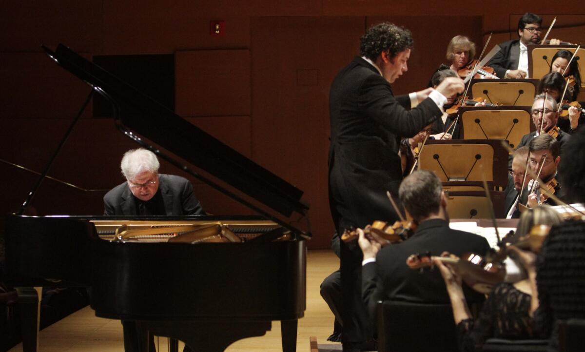 Emanuel Ax plays piano as Gustavo Dudamel conducts L.A. Philharmonic during the concert.