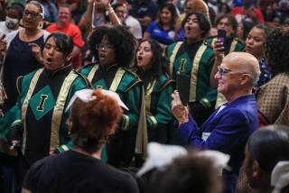 Inglewood, CA, Monday, August 12, 2024 - Record producer/philanthropist Jimmy Iovine captures the Inglewood High marching band as they perform at Morningside High. Iovine was there to introduce the Iovine and Young Center (IYC) in the Inglewood Unified School District. Starting the summer 2025, the initiative will offer a cutting-edge, interdisciplinary curriculum aimed at training young leaders, innovators, and entrepreneurs. (Robert Gauthier/Los Angeles Times)