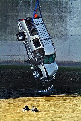 One person was pulled from a sport utility vehicle that crashed through a guardrail in Long Beach on Thursday and plunged into the Los Angeles River, authorities said. A woman thought to be in her 20s was pulled from the submerged vehicle and rushed to St. Mary Medical Center in Long Beach, said Long Beach Fire Battalion Chief Frank Hayes.