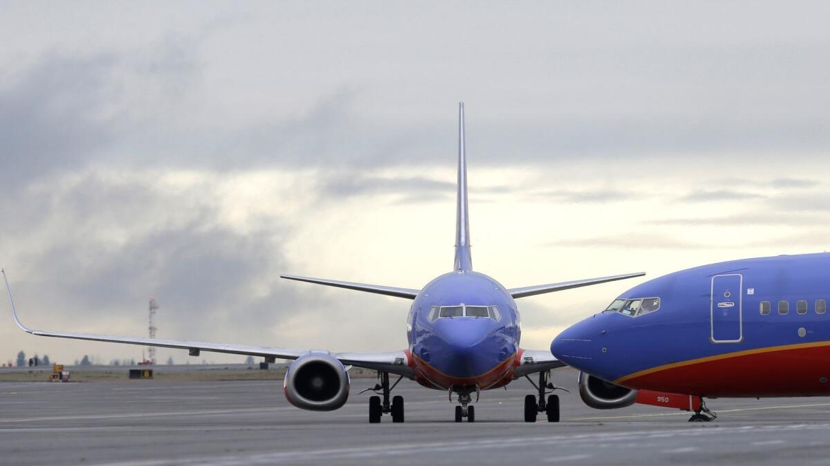 A Southwest Airlines 737 waits to taxi to a gate at Seattle-Tacoma International Airport in Seattle.