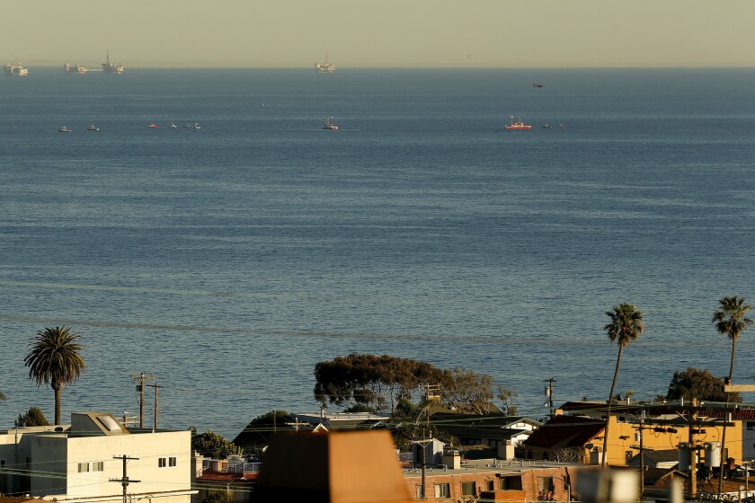 Rescue personnel were called out to investigate a possible mid-air collision between two small planes Friday off the coast of San Pedro.