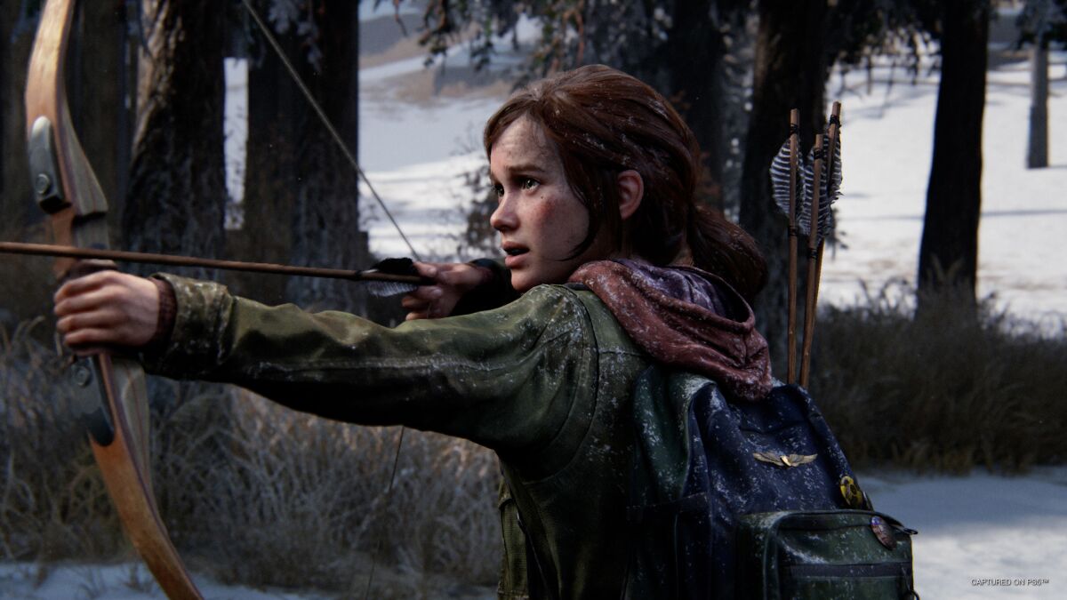 A girl in a video game holding a bow and arrow 