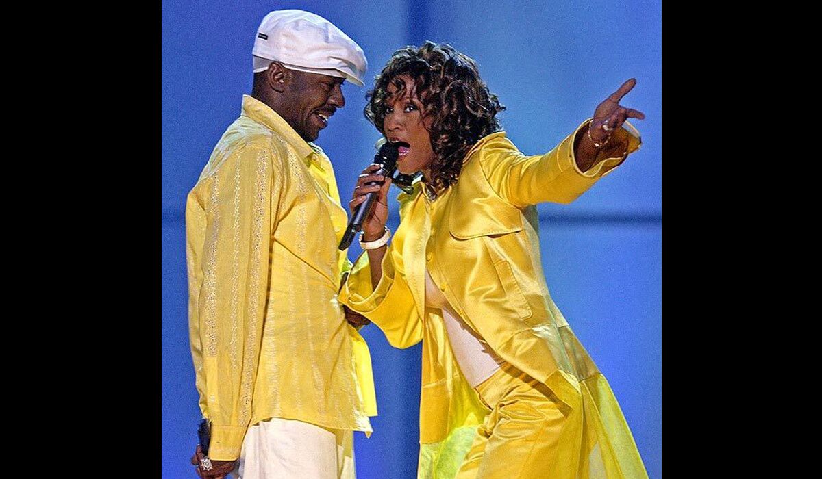 Whitney Houston and then-husband Bobby Brown perform in the "VH1 Divas" duets show in Las Vegas.