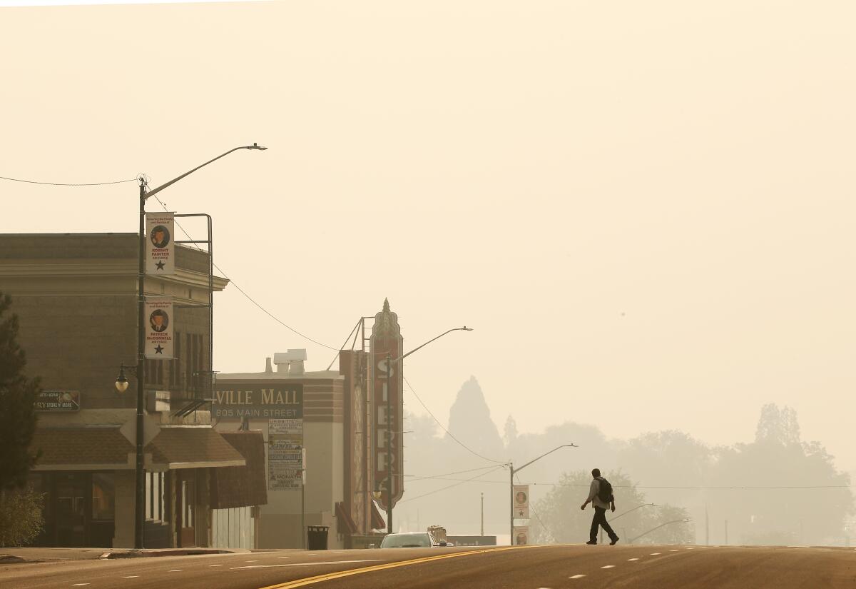 A pall of yellow smoke from the Dixie fire blankets the town of Susanville, Calif., on Aug. 20. 