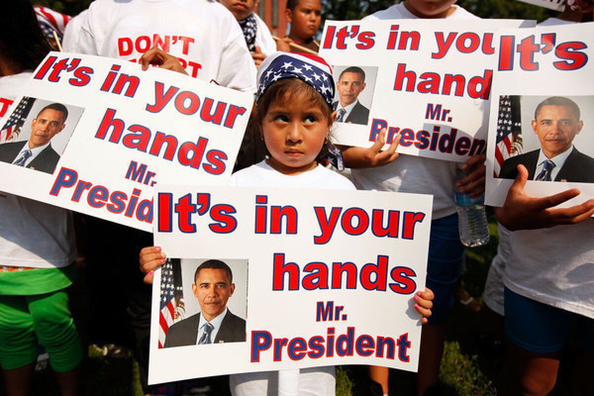According to the Applied Research Center's report "Shattered Families," at least 5,000 children of immigrants live in U.S. foster care because their parents were detained or deported. Above: Demonstrators describing themselves as "Obama Orphans," or children whose parents have been deported, are seen outside the White House in 2010.